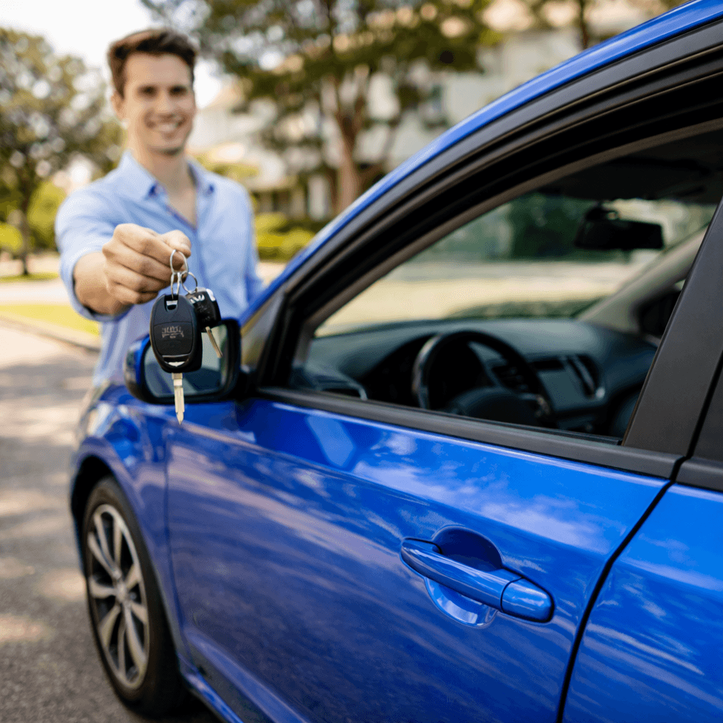 Owner handing over the keys to their car